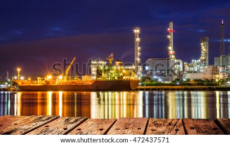 Oil refinery or petrochemical industry with ship at night in thailand. for Logistic Import Export background