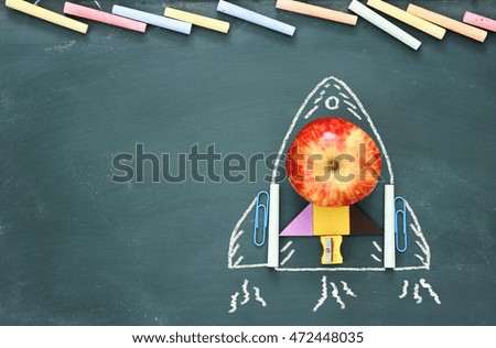 concept of imagination, creativity and education. Back to school. Objects and info graphics sketch on the blackboard