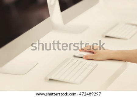 Woman working on modern office computer