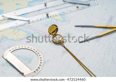 Navigation still-life. Skipper equipment, compass, ruler, protractor and a map. Sailing concept.