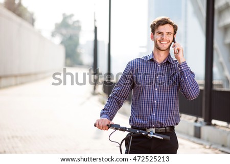 Joyful man talking on cell phone