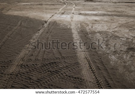 Wheel tracks on dirt road
