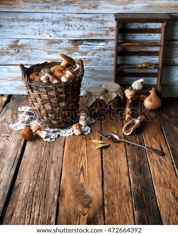 Fresh boletus in wicker basket in old rustic kitchen