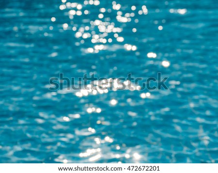 Blurred water background, water in the blue, white wave water on beautiful, wave water pool floor, Sunlight on Water A scintillation,