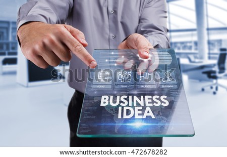 Business, Technology, Internet and network concept . Young business man working on the tablet of the future , select the virtual screen : business idea