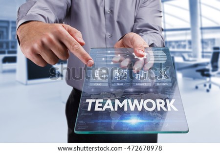 Business, Technology, Internet and network concept . Young business man working on the tablet of the future , select the virtual screen : teamwork