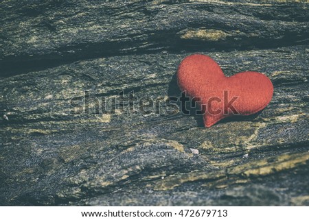 red hearts on rock on outdoor sun light