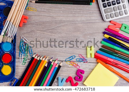 School supplies on wood background