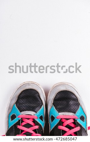 Old sneakers on white background