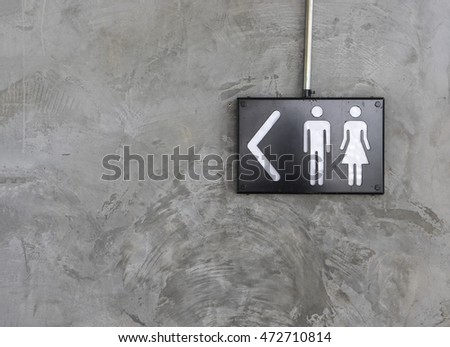 toilet sign on cement wall texture - can use to display or montage on product