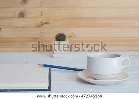 Planning and relax with coffee and blank notebook on table background selective focus / copy space
