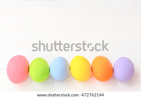 Pastel easter eggs on white background.