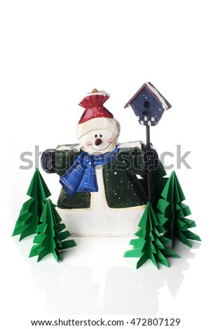 Christmas decoration, wooden snowman with origami trees isolated on white background