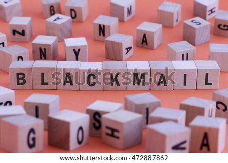 BLACKMAIL word on wooden cube isolated on orange background