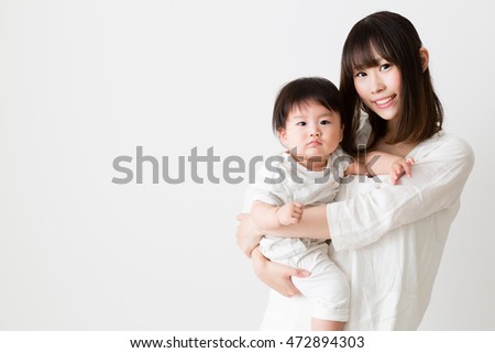 portrait of asian mother and baby isolated on white background