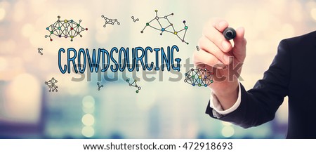 Businessman drawing Crowdsourcing concept on blurred abstract background 