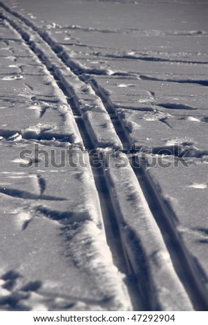 Pair of ski trace in the snow field