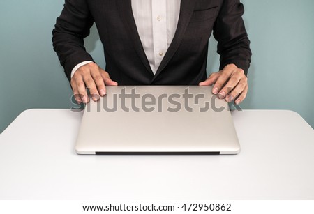 Businessman shut down laptop