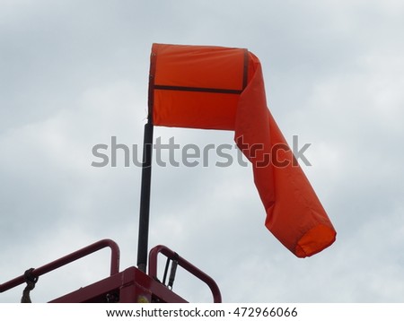 Wind sock with the cloudy sky