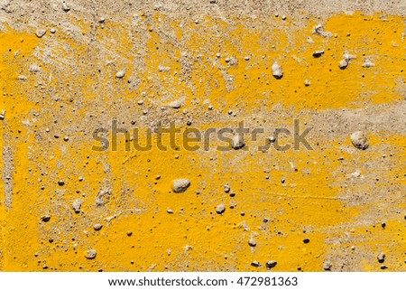 Texture. Old painted wall. Concrete background. Yellow color