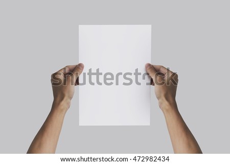 Hand holding A4 paper in the hand. Leaflet presentation. Pamphlet hand man. Man show offset paper. Sheet template. Book in hands. Booklet folding design. Fold paper sheet display read.