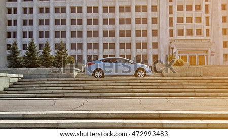 Blue car korean on black building stairs