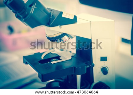 laboratory equipment Microscope in blue tone Royalty-Free Stock Photo #473064064