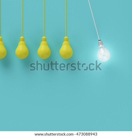 Hanging yellow light bulbs with glowing one different idea on light blue background , Minimal concept idea , flat lay , top