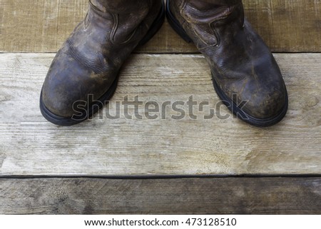 Safety boots on wood with copy space.