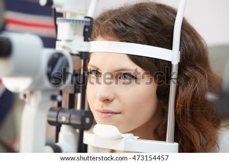 young woman taking eye care