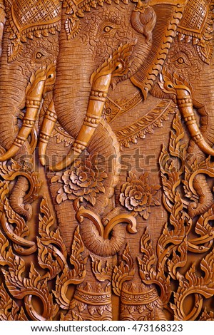 Wood carving pattern on the door of Thai temple.