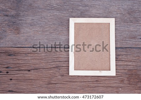 Blank wooden picture frame on wood table,interior design and copy space