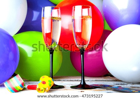 Two glasses of champagne and balloons on party