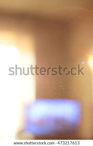 Abstract background - light flashes and bokeh. Sun rays. Shadows.