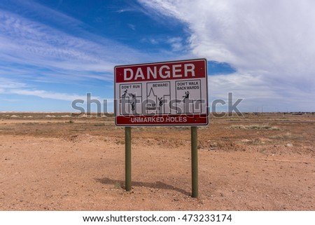 Danger sign for open mine shafts in the Coober Pedy opal fields, Australia