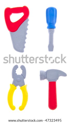 Whimsical tool set includes saw, screw driver, pliers and hammer.  Isolated on white with a clipping path. Royalty-Free Stock Photo #47323495