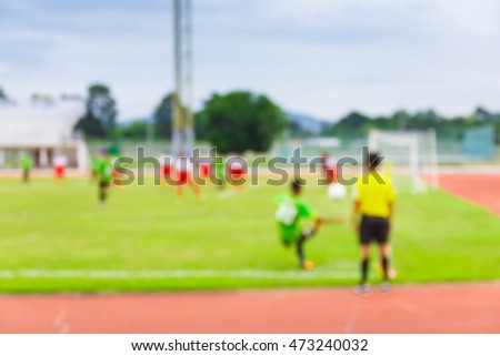 Blur image of football match at University, use for background.