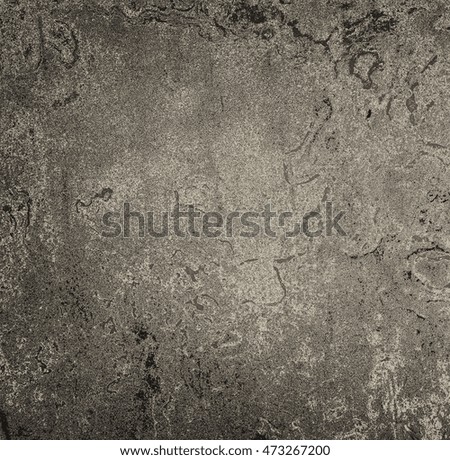 Dark gray grunge texture with stains and spots on the wall 
