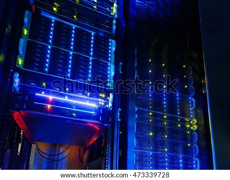 Server room colocation or colo with several cabinets, , switches and gateways. Royalty-Free Stock Photo #473339728