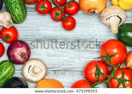 Colorful vegetables, fresh herbs and spices for healthy cooking on vintage table. Diet or vegetarian food concept. Background layout with free text space. Top view.