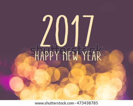 2017 happy new year on vintage blur festive bokeh light background Royalty-Free Stock Photo #473438785