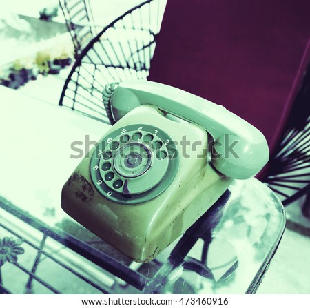 Vintage telephone with a rotary dial mechanism