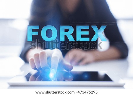Woman is using tablet pc, pressing on virtual screen and select "Forex".
