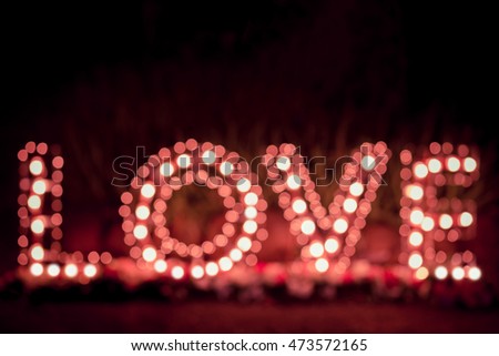 Disfocus of the Love word  light bulbs. Background.