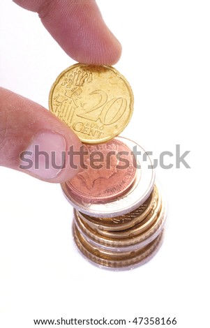 Hand holding a Euro coin