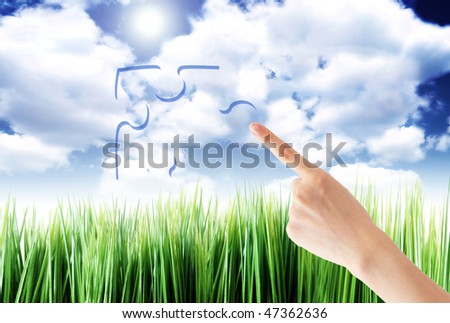 hand pointing a puzle symbol on a field background