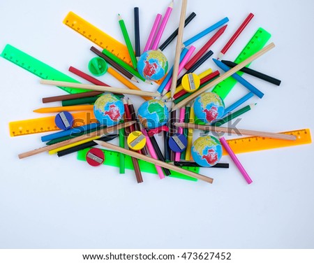 Different school supplies  on white background. colored pencils, rulers, sharpeners for pencils