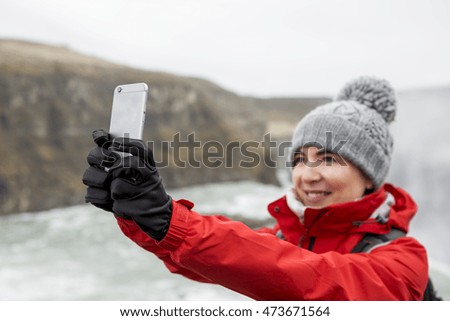 Female tourist having fun and making a selfie 