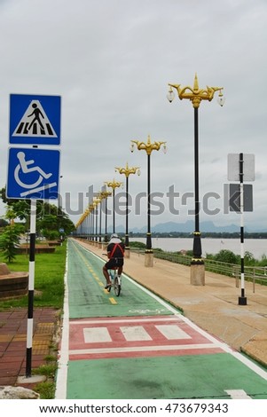 Biking on bike lane along the Mekong River in Nakhon Phanom Thailand