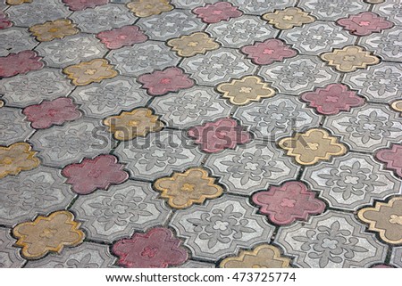 paving of sidewalk concrete colored tiles 